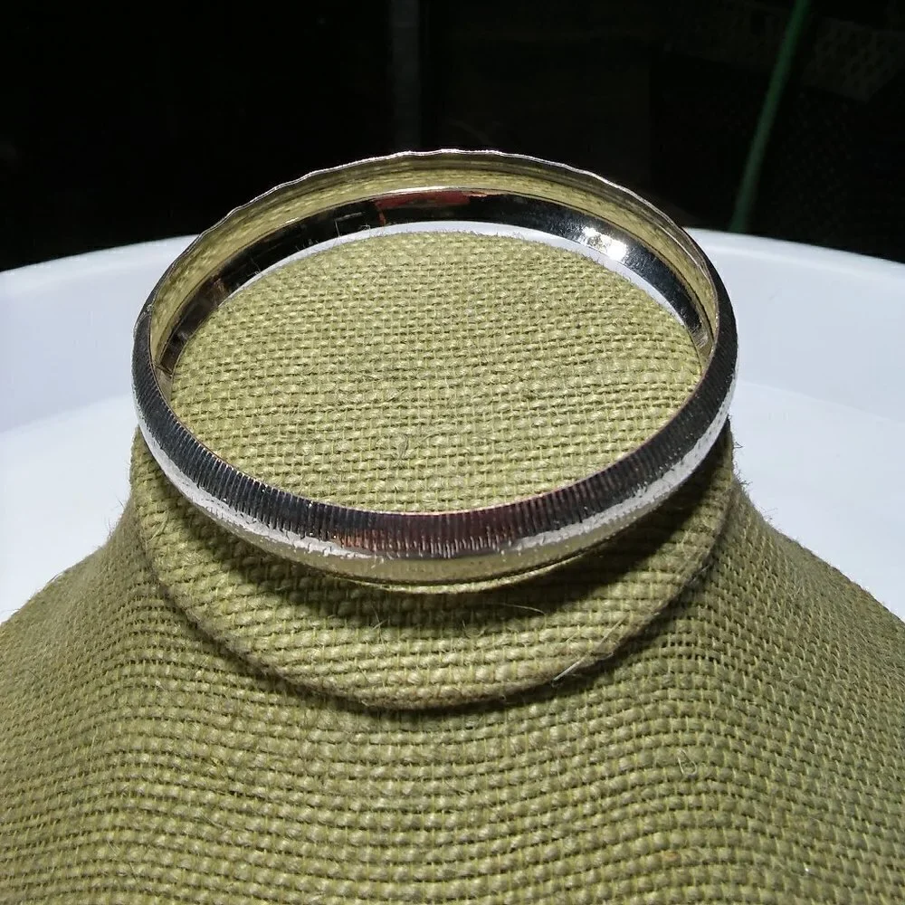 Women`s silver tone etched bangle bracelet. 2 3/4